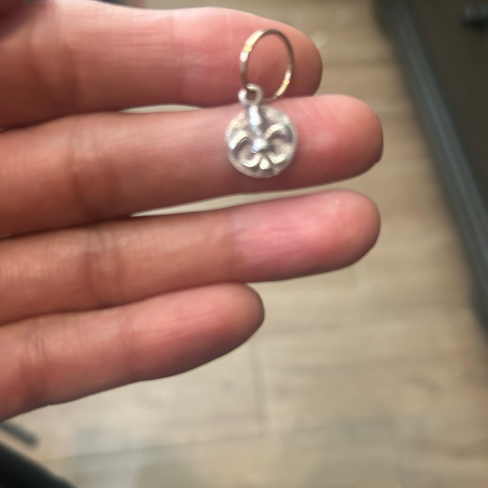 Lee Brevard 14K gold hoop and flier de lis silver charm individual earring.
